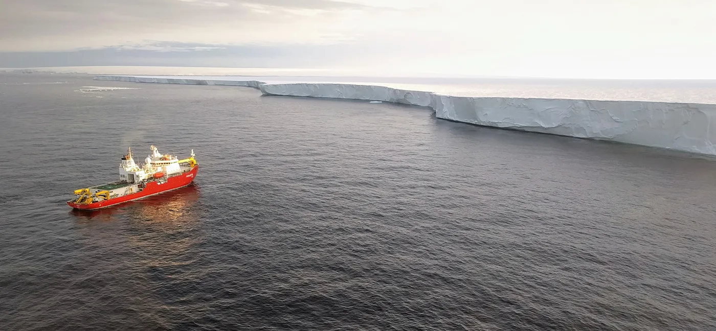 boat next to a glacier